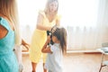 Mom puts on her child a gas mask, gas attack exercises, child education Royalty Free Stock Photo