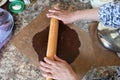 Mom rolls dough. chocolate dough. Hands working with dough preparation recipe bread. Female hands making dough for pizza. Woman`s Royalty Free Stock Photo