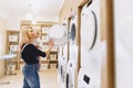 Mom shows her daughter a washing machine Royalty Free Stock Photo
