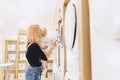 Mom shows her daughter a washing machine Royalty Free Stock Photo