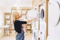 Mom shows her daughter a washing machine Royalty Free Stock Photo