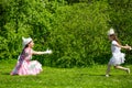 Mother and daughter in a summer park.