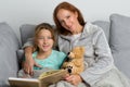 Mom reading book to her daughter Royalty Free Stock Photo