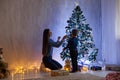 Mom with son adorn the Christmas tree lights Christmas new year Royalty Free Stock Photo
