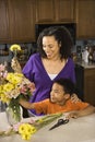 Mom and son arranging flowers