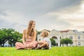 Mom and son on background of Old Town Hall in George Town in Pen