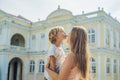 Mom and son on background of Old Town Hall in George Town in Pen