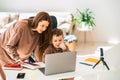 Mom and son doing school homework on laptop. Royalty Free Stock Photo