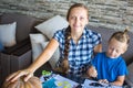 Mom with son draw a pumpkin for Halloween Royalty Free Stock Photo