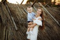 Mom and son have fun together. Enjoying life together concept. Happy mother and son having fun outdoors on a sunny summer day.