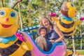 Mom and son having fun at an amusement park Royalty Free Stock Photo