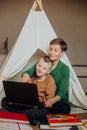 Mom son laptop browsing internet leisure entertainment Royalty Free Stock Photo