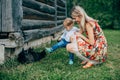 Mom and son are looking at the kittens Royalty Free Stock Photo