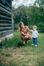 Mom and son are looking at the kittens Royalty Free Stock Photo