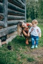 Mom and son are looking at the kittens Royalty Free Stock Photo