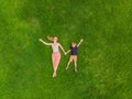 Mom and son are lying on the grass in the park, photos from the drone, quadracopter Royalty Free Stock Photo