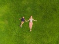 Mom and son are lying on the grass in the park, photos from the drone, quadracopter Royalty Free Stock Photo
