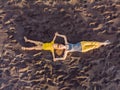 Mom and son are lying on the sand at sunset. View from the drone. Paradise, travel, vacation concept Royalty Free Stock Photo