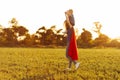 Mom and son play superheroes during the day outdoors. Mom holds the child on her shoulders, play and have fun together Royalty Free Stock Photo