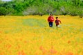 Mom and son running Spring flowers carpet Texas Austin peach tree Royalty Free Stock Photo