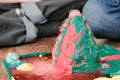 Mom and son`s hands make experience with plasticine volcano at home. Chemical reaction with gas emission.