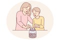 Mom and son together throw coins into moneybox, wanting to save up money for cherished wish