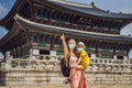 Mom and son tourists in medical mask in Seoul, South Korea. Travel to Korea concept. Traveling with children concept