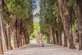 Mom and son tourists walking together in Montenegro. Panoramic summer landscape of the beautiful green Royal park Royalty Free Stock Photo
