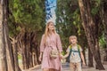 Mom and son tourists walking together in Montenegro. Panoramic summer landscape of the beautiful green Royal park Royalty Free Stock Photo