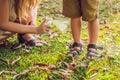 Mom and son use mosquito spray.Spraying insect repellent on skin outdoor Royalty Free Stock Photo