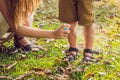 Mom and son use mosquito spray.Spraying insect repellent on skin outdoor Royalty Free Stock Photo