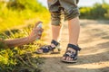 Mom and son use mosquito spray.Spraying insect repellent on skin outdoor Royalty Free Stock Photo