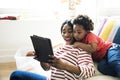 Mom and son using tablet together Royalty Free Stock Photo