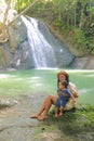 Mom and son on Wafsarak Waterfall on Biak Island