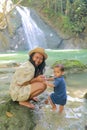 Mom and son on Wafsarak Waterfall on Biak Island