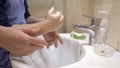 Mom and son wash their hands together. Mother teaches her son to properly soap his hands. Family education concept Royalty Free Stock Photo