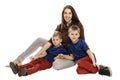 Mom and sons hug and smile. Tenderness and love. Isolated on a white background