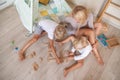 Joint leisure of mother with children play domino Royalty Free Stock Photo