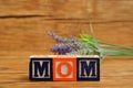 Mom spelled with colorful alphabet blocks and lavender Royalty Free Stock Photo