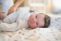 Mom swaddles the baby. on the table of pelina in the bath. Mom and her baby. The concept of a happy family. Beautiful conceptual