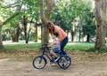 Mom teach to her little son to ride a bicycle. Royalty Free Stock Photo