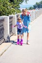 Mom teaches daughter to roller-skate