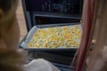 Mom teaches her daughters to cook in the kitchen. The family bakes cookies in the oven Royalty Free Stock Photo