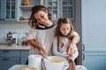 Mom teaches her little daughter to cook food Royalty Free Stock Photo
