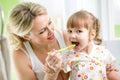 Mom teaches kid teeth brushing Royalty Free Stock Photo