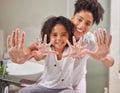 A mom teaching child to clean their hands, using soap and water in the bathroom to destroy germs to stay healthy. Kid Royalty Free Stock Photo