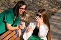 Mom and teenage daughter eat ice cream on walk Royalty Free Stock Photo