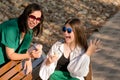 Mom and teenage daughter eat ice cream on walk Royalty Free Stock Photo