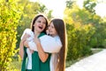 Mom and teenage daughter hugging on walk in park Royalty Free Stock Photo