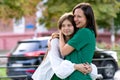 Mom and teenage daughter hugging on walk in park Royalty Free Stock Photo